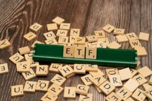 scrabble tiles spelling out letters on a wooden table